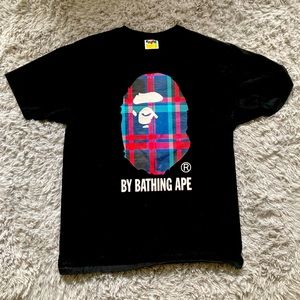 I’m selling my Bape T shirt XL with the flannel ape logo Because it fits small